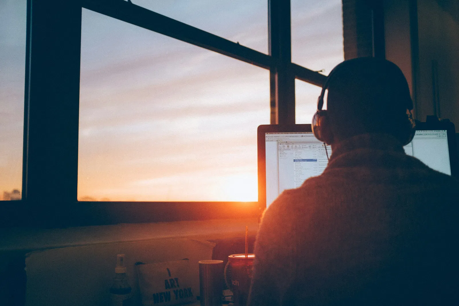 a man sitting in front of a computer