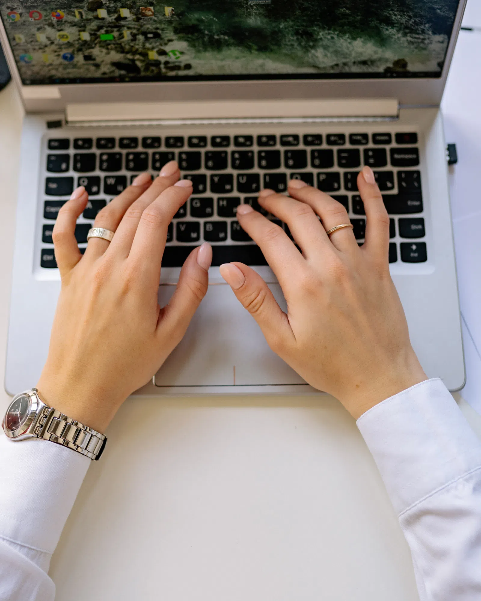a person typing on a laptop