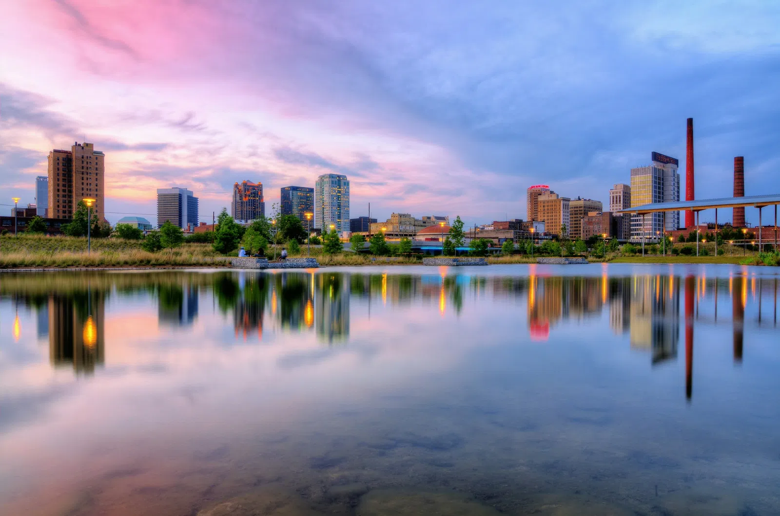a body of water with a city in the background