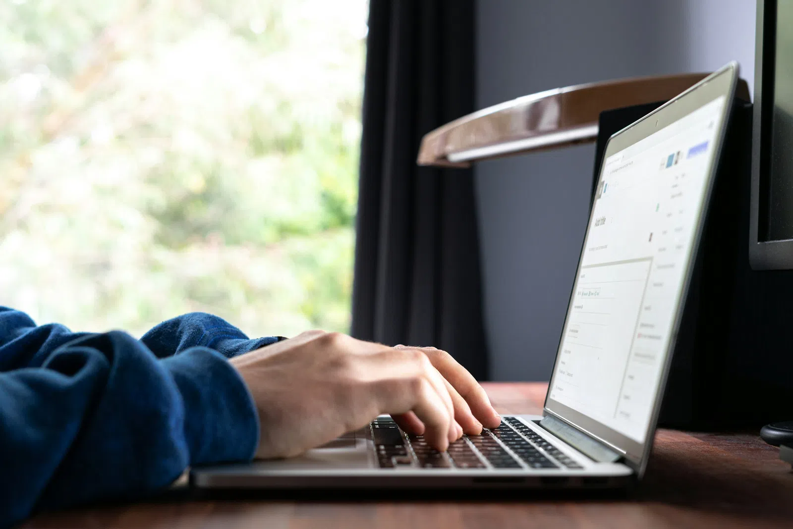 a person typing on a laptop