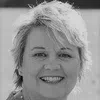 a woman smiling for the camera